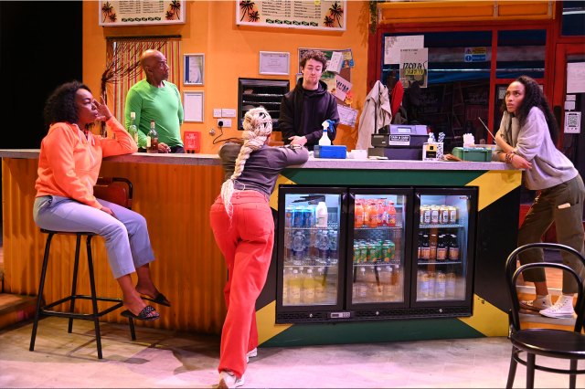 A group of actors gathered on a takeaway set.